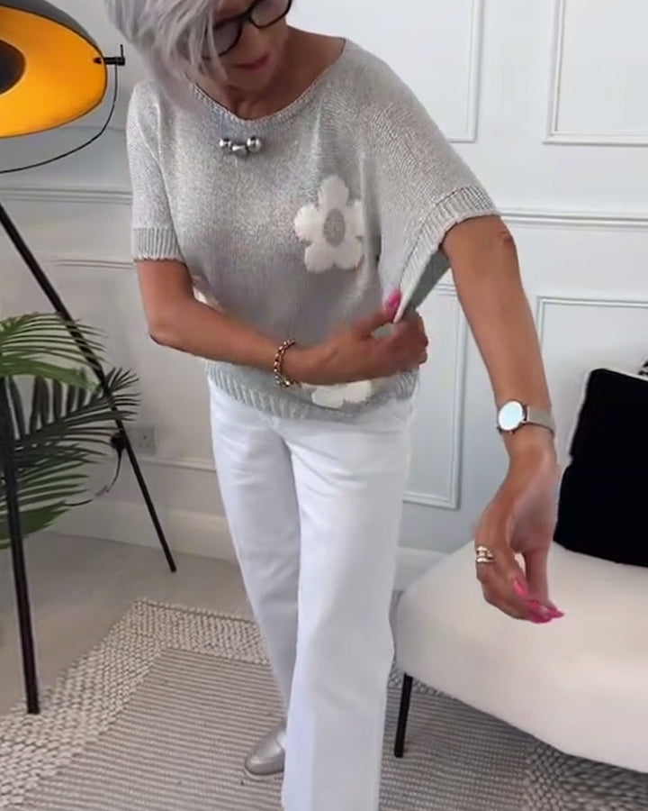 Slim fit sweater with round neck and floral patterns