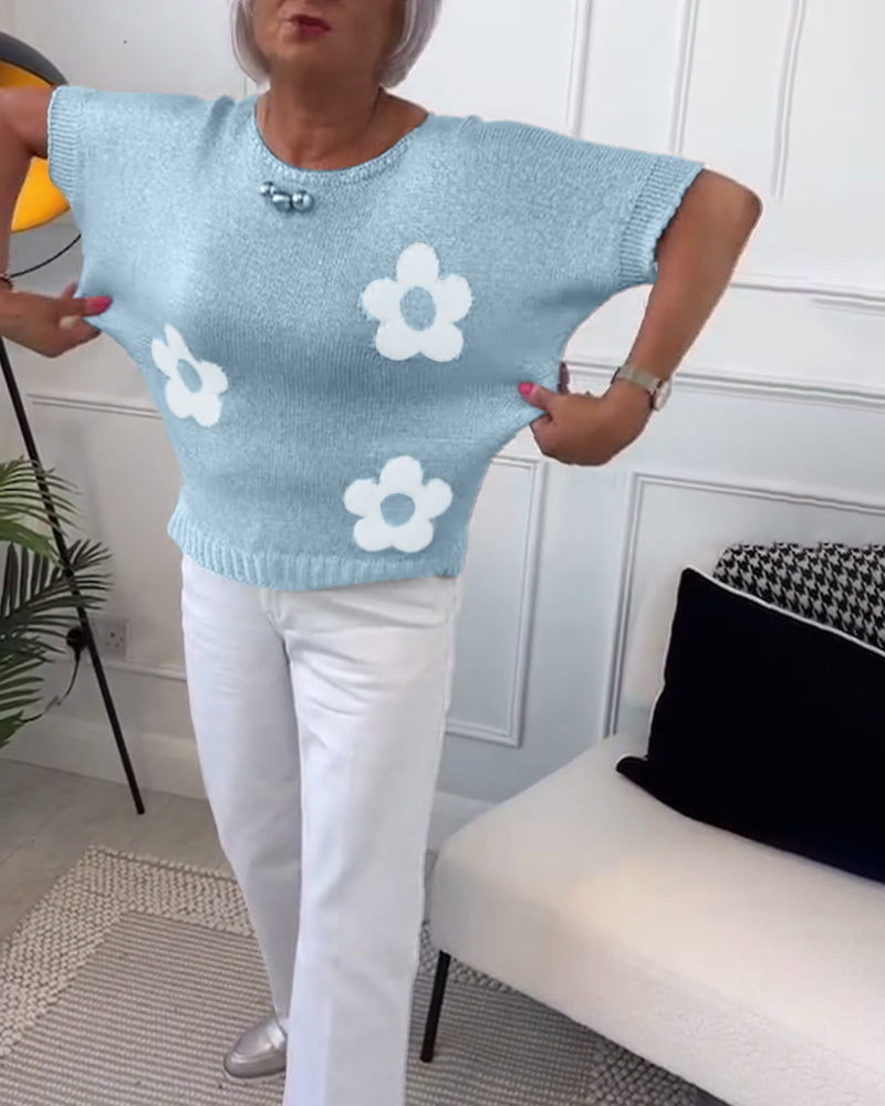 Slim fit sweater with round neck and floral patterns