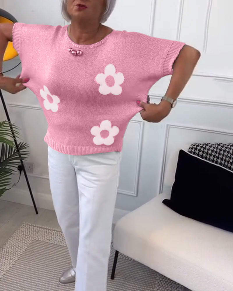 Slim fit sweater with round neck and floral patterns