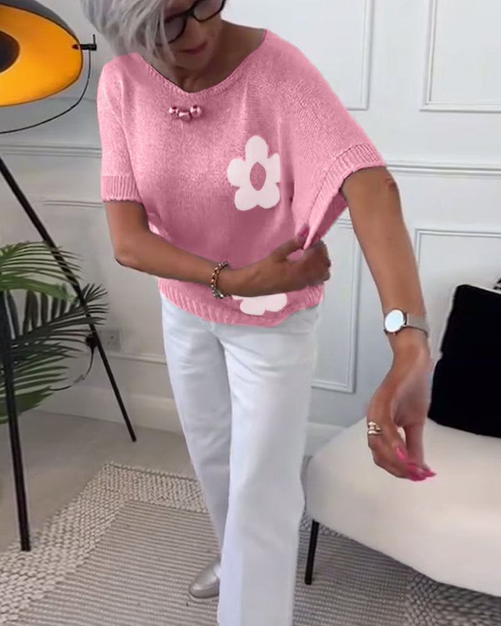 Slim fit sweater with round neck and floral patterns