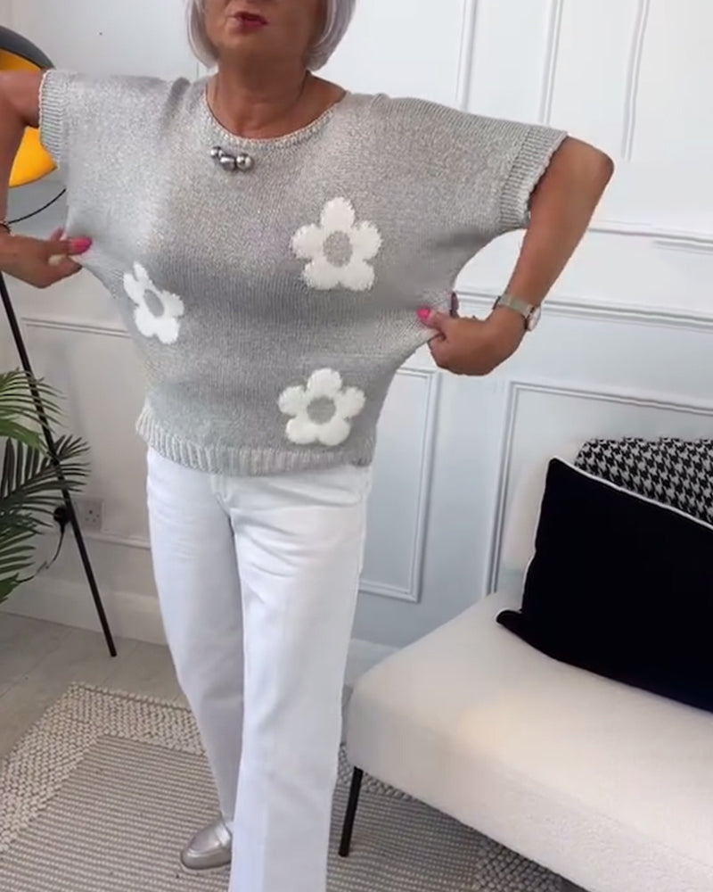 Slim fit sweater with round neck and floral patterns